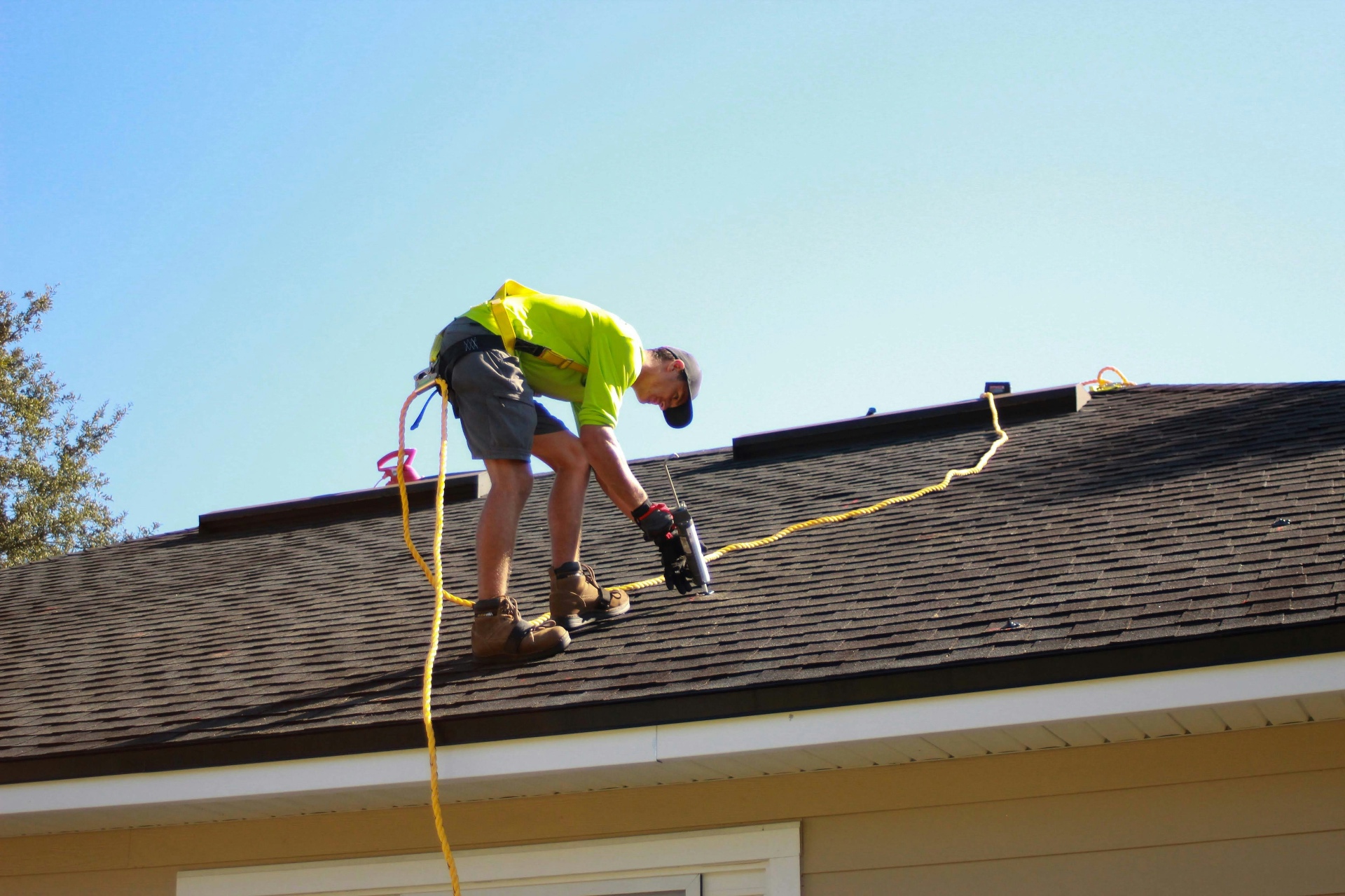 Roofing contractor working on residential job site
